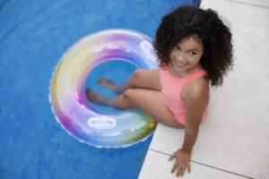 Child Having Fun With Floater Pool