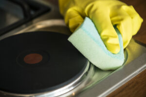 Closeup Hands Wearing Gloves Wiping Stove Domestic Chores Concept