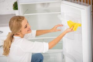 Blonde Housewife White Shirt Cleaning Fridge