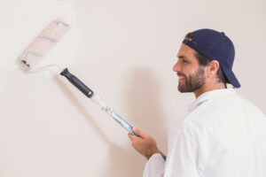 Painter Painting Walls White