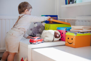 Little Boy Opening Box With Toys