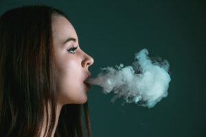 Face Vaping Young Woman Black Studio