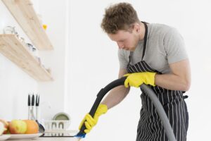 Man With Vacuum Cleaning