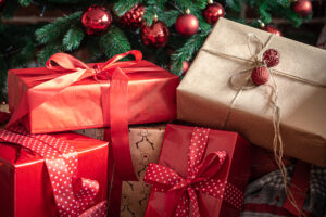 Closeup Red Gift Boxes Near Christmas Tree