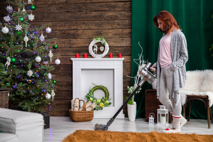 Girl Is Vacuuming Living Room Decorated Christmas