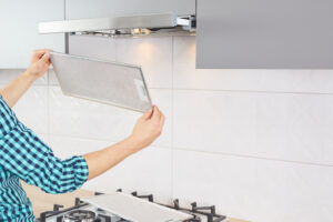 Mans Hands Removing Filter From Cooker Hood Cleaning Service Replacing Filter Kitchen Hood Modern Kitchen Fan Range Hood